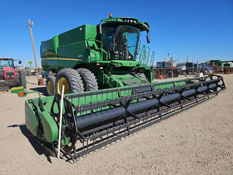 2012 John Deere S670 Combine w/ JD 930R 30’ Grain Platform, sold November 2025
