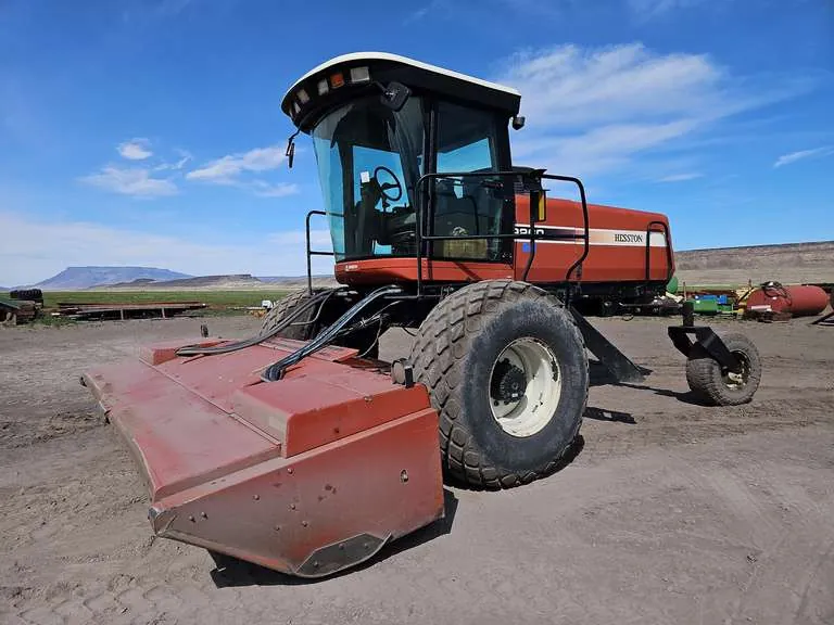 Hesston 9260 Windrower w/ 9075 15’ Rotary Disc Head, sold May 2026