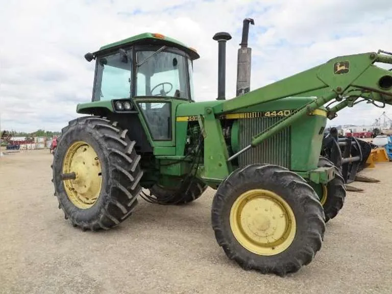 John Deere 4440 160HP Diesel Tractor with JD 158 Loader & Hay Fork, sold June 2022