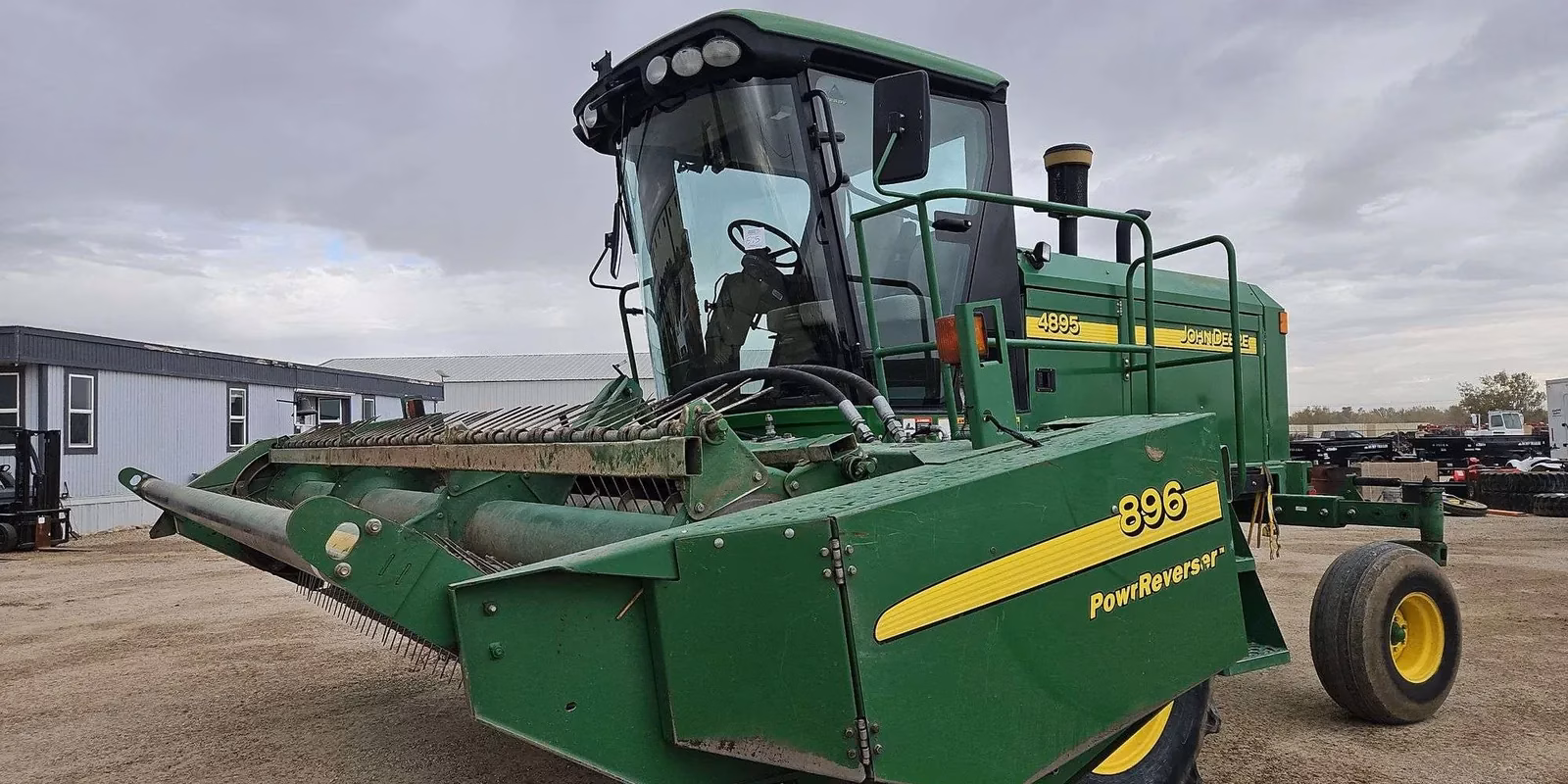 John Deere 4895 windrower with 896 PowReverser header Lot 575 fall open consignment auction