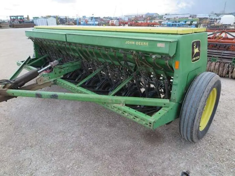 John Deere 8300 12' Double Disc Grain Drill With Front Seeder Attachment, sold March 2022