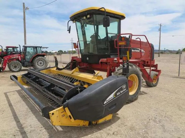 New Holland HW305 Self Propelled Windrower, sold June 2021